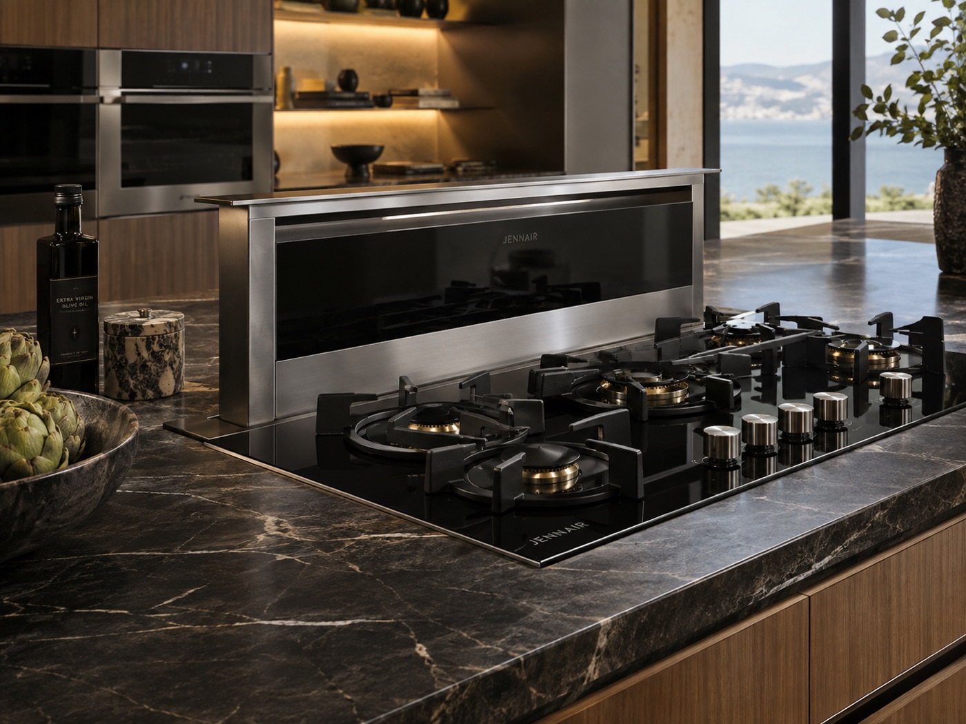 Kitchen island with a JennAir gas cooktop and integrated downdraft ventilation system in a Houston home